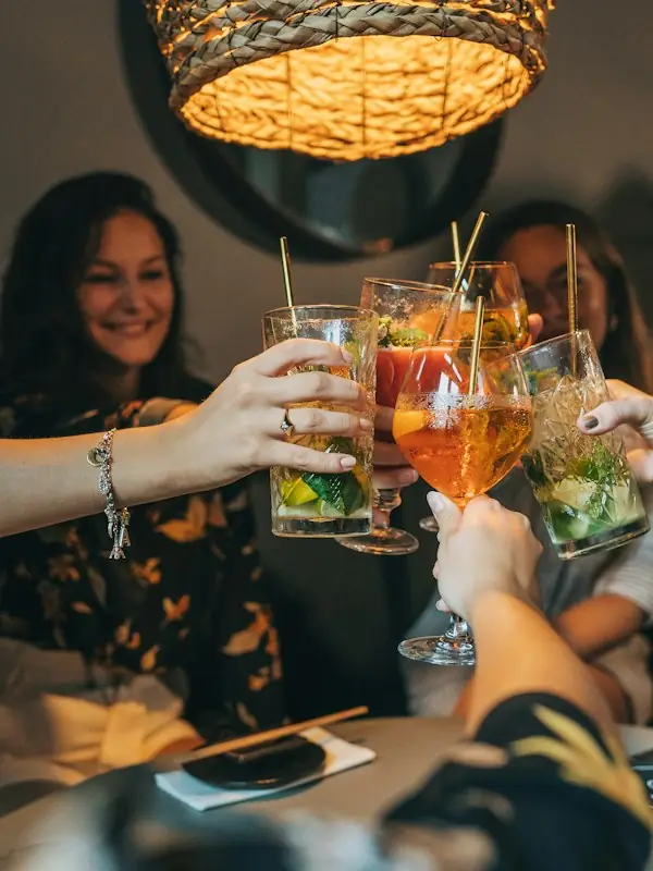 A group raising cocktails together