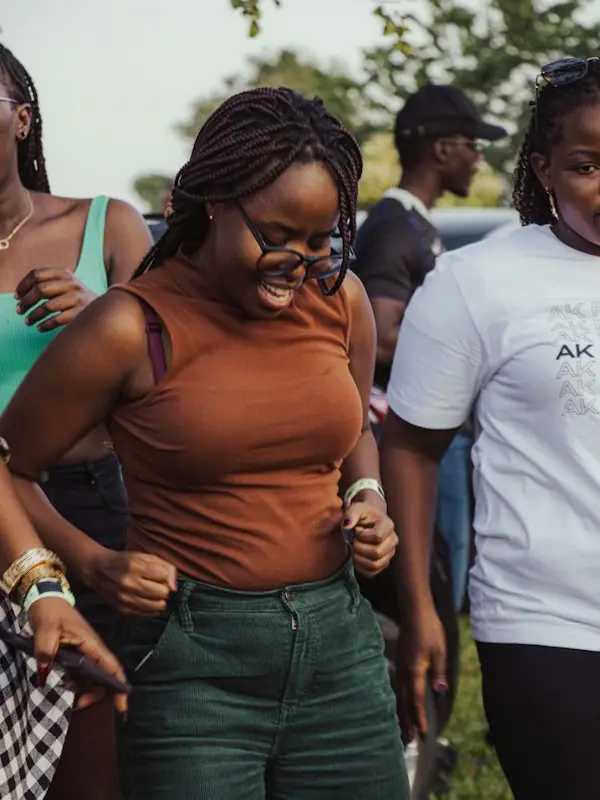 Friends laughing together at an outdoor gathering